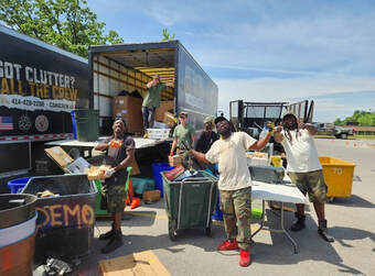 People standing in front of truck