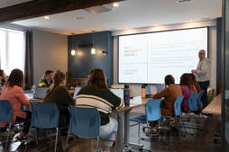 People watching presentation